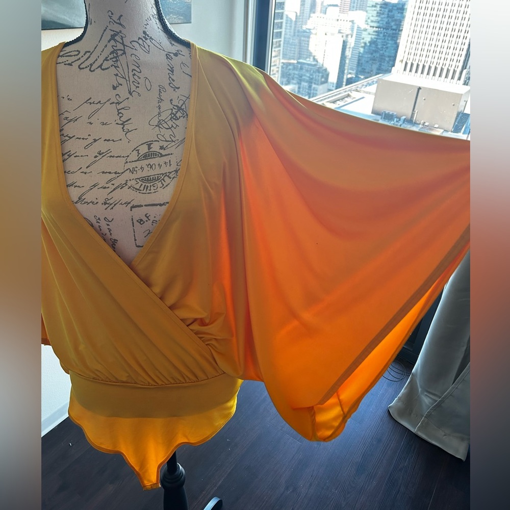 Yellow gold winged arm bodysuit